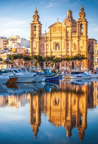 Malta church reflecting off water.