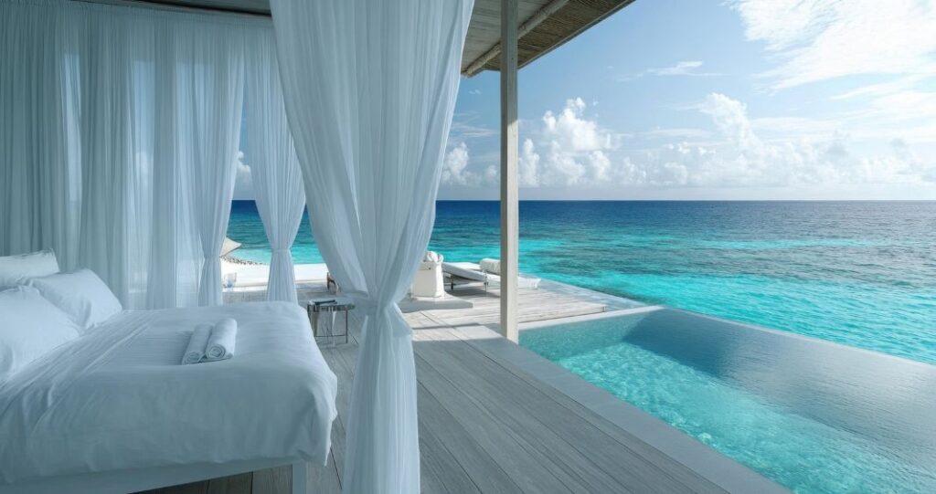 View of luxury resort room with infinity pool