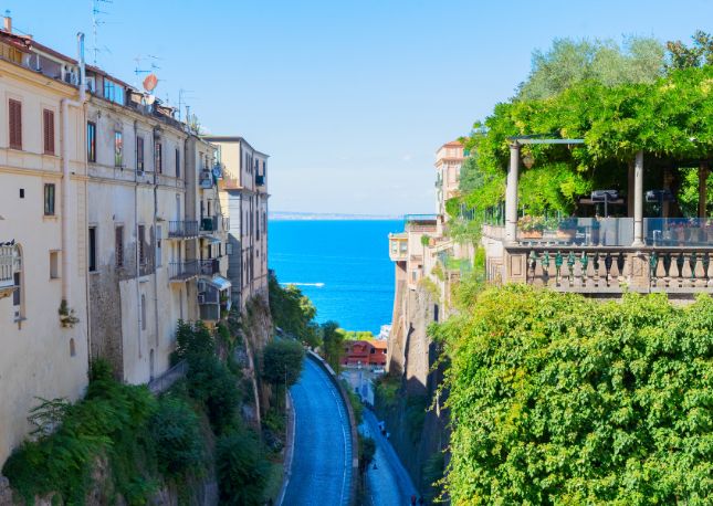 Explore the romantic town of Sorrento, known for its lemon groves - and limoncello - and a pedestrian-only area with medieval balconied buildings.